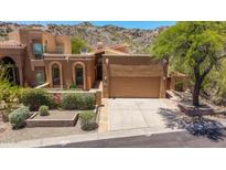 Charming home with well-manicured landscaping, mature trees, and a two-car garage at 11238 N 11Th St, Phoenix, AZ 85020