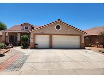Charming single-Gathering home features a two-car garage, a tile roof, and well-maintained landscaping at 1643 E Oakland St, Chandler, AZ 85225