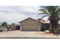 Charming single-story home featuring a well-maintained yard and two-car garage at 2004 N 108Th Dr, Avondale, AZ 85392