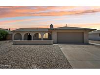 Charming single-story home featuring an arched entryway and a desert landscape at 2519 E Geneva Dr, Tempe, AZ 85282