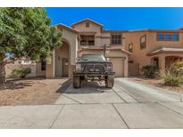 Two-story home with arched entry, balcony and basketball hoop over garage at 3625 W South Butte Rd, San Tan Valley, AZ 85144