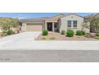 Charming single-story home featuring a well-maintained front yard and a neutral color scheme at 5139 N 185Th Ave, Litchfield Park, AZ 85340