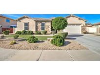 Charming home exterior featuring manicured landscaping and stone accents on the facade at 5316 N 186Th Dr, Litchfield Park, AZ 85340