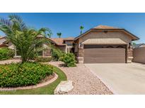 Beautiful home featuring mature landscaping and a two-car garage at 717 N Mckemy Ave, Chandler, AZ 85226