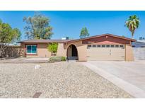Charming single-story home with a spacious front yard and an attached two-car garage at 11030 N 47Th Ave, Glendale, AZ 85304