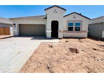 Charming single-story home featuring a neutral color palette and a convenient two-car garage at 11891 E Cliffrose Ln, Florence, AZ 85132