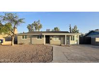 Charming single-story home featuring desert landscaping, neutral paint, and a covered front porch at 1627 W Pueblo Ave, Mesa, AZ 85202
