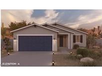 Charming single-story home with a two-car garage and desert landscaping, creating a serene curb appeal at 17585 N Bolerno Dr, Maricopa, AZ 85138