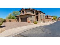 Beautiful two-story home featuring a two-car garage, desert landscaping and a brick-paved driveway at 3030 N Saranac --, Mesa, AZ 85207