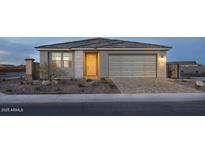 Charming single-story home featuring a well-manicured front yard and a two-car garage at 3310 E Valleyhigh Trl, San Tan Valley, AZ 85143