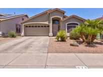 Charming single-Gathering home with a two-car garage, desert landscaping, and covered entryway at 878 E Mountain View Rd, San Tan Valley, AZ 85143