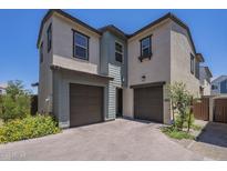 Charming two-story home featuring a two-car garage and a beautifully paved driveway at 9920 E Tamery Ave, Mesa, AZ 85212