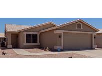 Charming single-story home with well-maintained landscaping and two-car garage at 1341 E Bellerive Dr, Chandler, AZ 85249