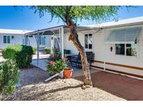 Cozy patio with brick pavers and gravel landscaping, offering a charming outdoor retreat at 17200 W Bell Rd # 2162, Surprise, AZ 85374