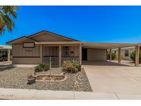 Charming single-story home featuring a covered porch and convenient carport, surrounded by low-maintenance landscaping at 2263 N Trekell Rd # 159, Casa Grande, AZ 85122