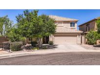 Charming two-story home with a well-manicured front yard and a spacious two-car garage at 28806 N 23Rd Ln, Phoenix, AZ 85085