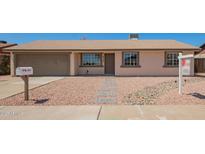 Charming single-story home with a neutral color scheme, low-maintenance rock landscaping and a two car garage at 3114 W Villa Maria Dr, Phoenix, AZ 85053