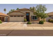 Charming single-story home featuring a two-car garage and desert landscaping for easy maintenance at 3905 E Derringer Way, Gilbert, AZ 85297