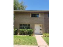 Charming two-story home with a well-maintained front yard and classic brick facade at 4533 N 17Th Ave, Phoenix, AZ 85015