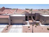 Charming townhome with a two-car garage, desert landscaping, and a red tile roof at 8785 E Greenview Dr, Gold Canyon, AZ 85118