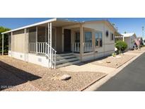 Charming single-story home with a screened-in porch, easy-care landscaping, and convenient covered parking at 11596 W Sierra Dawn Blvd # 182, Surprise, AZ 85378