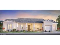 Charming single-story home featuring a neutral color palette, covered porch, and a two-car garage at 17625 W Middlebury St, Surprise, AZ 85388