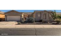 Charming single-story home with desert landscaping and a two-car garage at 42625 W Sandpiper Dr, Maricopa, AZ 85138