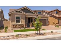 Charming single-story home featuring a stone-accented facade, landscaped front yard and attached two-car garage at 4314 E Bernice St, Gilbert, AZ 85295