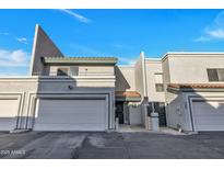 Charming townhome featuring attached garage, well-maintained landscaping, and red tile roof detail at 8619 N 67Th Dr, Peoria, AZ 85345