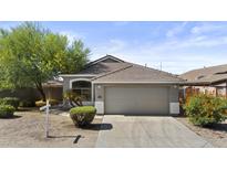 Charming single-Gathering home with a two-car garage and desert landscaping at 8753 E Plata Ave, Mesa, AZ 85212