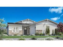 Charming single-story home featuring stone accents, a black roof, and a well-manicured lawn with desert landscaping at 17629 W Middlebury St, Surprise, AZ 85388