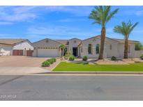 Charming single-story home featuring a neutral color palette, a well-manicured yard, and desert landscaping at 20151 E Via Del Palo St, Queen Creek, AZ 85142