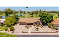 Charming single-story home with a well-manicured front yard and golf course views at 2448 S Standage --, Mesa, AZ 85202