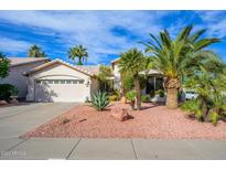 Charming home featuring manicured landscaping, a two-car garage, and a well-maintained lawn at 316 W Anderson Ave, Phoenix, AZ 85023