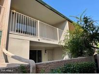 Charming condo featuring a private balcony overlooking well-maintained grounds at 6565 N 19Th Ave # 38, Phoenix, AZ 85015