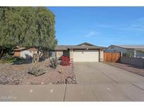 Charming single-story home featuring low maintenance desert landscaping and a two-car garage at 7132 W Vermont Ave, Glendale, AZ 85303