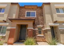 Beautiful townhome featuring stone accents, a covered entryway and low maintenance landscaping at 7726 E Baseline Rd # 154, Mesa, AZ 85209