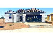 Image of new home construction including the framing and building materials at 1528 E Mason Dr, Casa Grande, AZ 85122