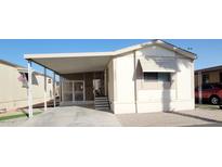 Inviting mobile home with covered parking and charming front porch at 17200 W Bell Rd # 1622, Surprise, AZ 85374