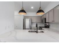 Bright kitchen featuring stainless steel appliances, modern countertops, and stylish pendant lighting at 20100 N 78Th Pl # 2114, Scottsdale, AZ 85255