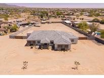 Expansive single-story home featuring a large lot and charming desert landscaping at 22414 W Meade Ln, Buckeye, AZ 85326