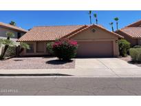 Charming single-story home featuring a well-maintained yard and a two-car garage at 2723 E Rockledge Rd, Phoenix, AZ 85048