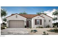 Charming single-story home featuring a tile roof, stucco walls, and a two-car garage at 5705 W St Moritz Ln, Glendale, AZ 85306