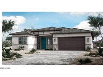 Charming single-story home featuring a two-car garage, desert landscaping, and a bright turquoise front door at 5857 W Mauna Loa Ln, Glendale, AZ 85306