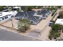 A construction project shows a multi-unit building with gray roofs and light siding surrounded by fencing at 6426 E Turquoise Ave, Paradise Valley, AZ 85253