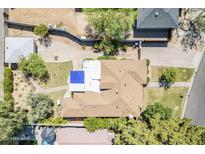 Aerial view of home showcasing the backyard, pool, mature trees, and surrounding neighborhood at 1274 E Edgemont Ave, Phoenix, AZ 85006