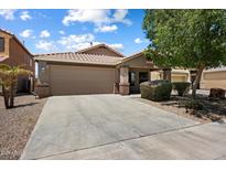 Charming single-Gathering home with a spacious driveway and low maintenance desert landscaping at 20814 N Dries Rd, Maricopa, AZ 85138