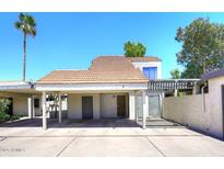 Charming home featuring a covered parking area and desert landscaping on a sunny day at 2416 W Caribbean Ln # 2, Phoenix, AZ 85023