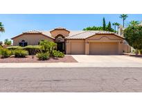 Charming single-story home with well-manicured landscaping and a two-car garage at 3535 E Brookwood Ct, Phoenix, AZ 85048