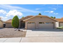 Charming single-story home with a two-car garage, well-maintained landscaping, and a classic desert aesthetic at 4439 W Cielo Grande --, Glendale, AZ 85310